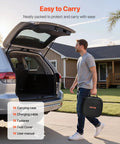 A man carrying a VEVOR carrying case for the 21 Foot J1772 EV Charger Extension Cable 48 Amp Heavy Duty Charging Cord.