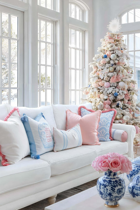 Living room with decorated Christmas tree, white couch, Coastal Chic 20x20 Throw Pillow Cover With Scalloped Border in blush pink.