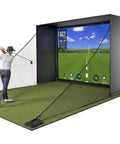 Player using the Rock Solid Golf Simulator Enclosure With 10X8 Ft HD Impact Screen for practice indoors.