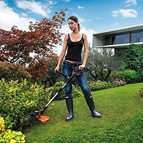 Person using Worx Weed Eater String Trimmer outdoors