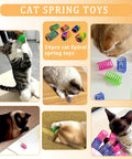 Cats playing with different colored springs from the 100 Piece Cat Toys Variety Pack For Indoor Cats With Mice Toys Sparkle Balls Soft Pom Poms And Spring Toys A Pawsome Kitten Starter Set For Boredom Relief And Daily Exercise