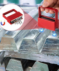 Two Pack Magnetic Handle Grabber With 50 Lb Pull Red Finish Magnetic Pickup Tool lifting metal pieces in workshop.