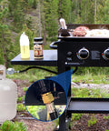 Six Feet Low Pressure Propane Regulator With CSA Certified LPG Hose For LP Gas Grills Heaters And Fire Pits Type1 QCC1 Compatible Outdoor Cooking Camping Tailgating connected to a grill in forest setting