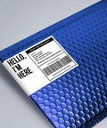 Kick Your Shipping Game With Smooth Operator Laser Compatible Labels Featuring Sure Feed Tech For Zero Jamming Hassles 3.5 X 5 Inches White 400 Count Ready To Roll Easy Peasy Mailing on a blue bubble mailer.