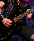 Fresh Hip Hop Drip Wide PU Leather Cuffs For Men Adjustable Punk Rock Gothic Wrists Band Pair worn while playing guitar.