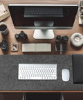 Massive Felt Desk Mat 40x16 Inches Non Slip Full Desk Mouse Pad For Computer Keyboard Setup Office And Gaming Desk Protector Premium Felt Desk Pad 100x40cm For Smooth Mouse Tracking And Desk Surface Protection on a wooden desk with computer, keyboard, and mouse.