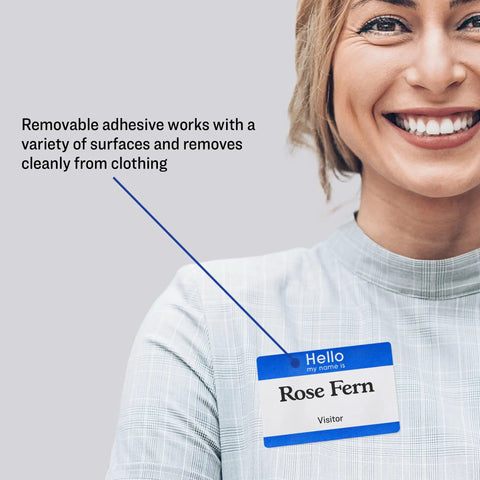 Smiling person wearing customizable Hello My Name Is name tag white with blue border removable adhesive for laser and inkjet printing
