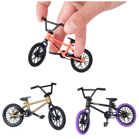 Hand holding an orange BMX Finger Bike from the BMX Finger Bike 3-Pack Officially Licensed Totally Customizable Collectible Mini Replica Toys With Real Metal Frames And Graphics For Collectors And Kids 6 And Up Amazon Exclusive.