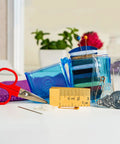 Travel Sewing Kit In Colorful Translucent Case With 10 Colored Threads, 25 Inch Tape Measure, Needles, and Quick Fix Gear