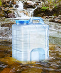 Camping Water Jug With Lid 20L Easy Pour Handle And Wide Mouth Large Opening Portable Water Storage Carrier outdoors near stream
