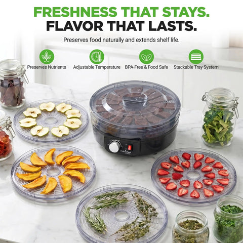 Professional Electric Countertop Food Dehydrator With Five Stackable Trays For Making Jerky, Dried Fruit, Herbs And Veggies on a countertop with dried fruits and herbs.
