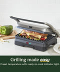 Cuisinart Griddler Indoor Grill And Panini Press With Removable Nonstick Plates grilling a sandwich with melted cheese.