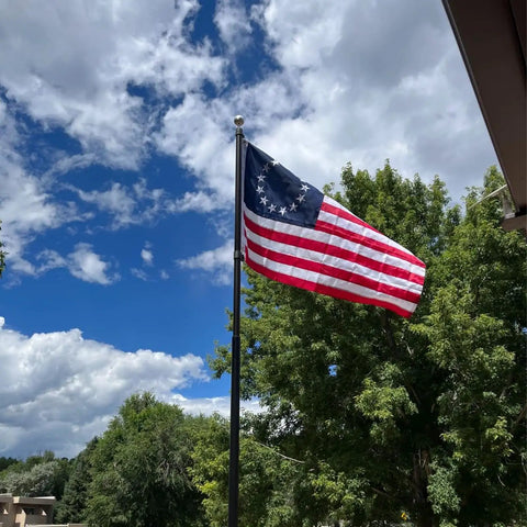 All American Betsy Ross Flag 3x5 Ft Outdoor Embroidered 13 Star Flag Double Sided Colonial Banner waving with trees and sky backdrop