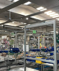 Industrial 8 Ft HVLS Ceiling Fan Featuring Brushless Motor Built in VFD and Remote Control with Savage Airflow in a warehouse.