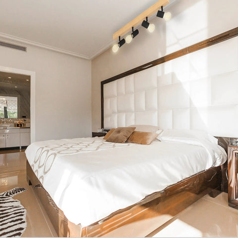 Bedroom with Kingswood 38 Inch Dope Modern Wood Track Light With Four LED Dimmable Heads in black above bed