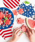 Child using star cutter on watermelon with Patriotic Party Tableware Kit Disposable Dinner Plates 9in And Dessert Plates 7in
