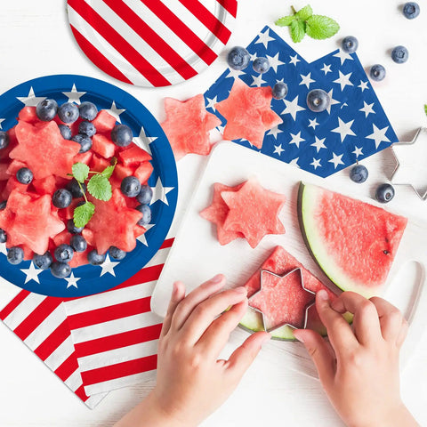 Child using star cutter on watermelon with Patriotic Party Tableware Kit Disposable Dinner Plates 9in And Dessert Plates 7in