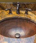 Oil Rubbed Bronze 1.5 Inch Non Overflow Pop Up Bathroom Sink Drain With Push Pop Top Design in a granite vanity setup