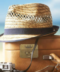 Woven straw hat resting on vintage suitcase with Old School Brass Hasp Latch For Jewelry Boxes And Wooden Lock Boxes Durable Antique Look Decorative Clasp For Furniture Decor Cabinets Chests And Craft Projects