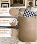 Boho Jute Laundry Hamper Basket With Handles Tall Wicker Hamper 16x20 inches in a living room, holding a checkered pillow.