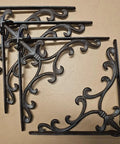 Four Sturdy Cast Iron Shelf Bracket Set 10 By 10 Inches, Ornate Fleur De Lis Design, Matte Brown Finish displayed on surface