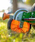 Close-up of Dual Tracking Wheels on a Manual 20-Inch 5-Blade Push Reel Lawn Mower With Ball Bearing Reel, Green Finish