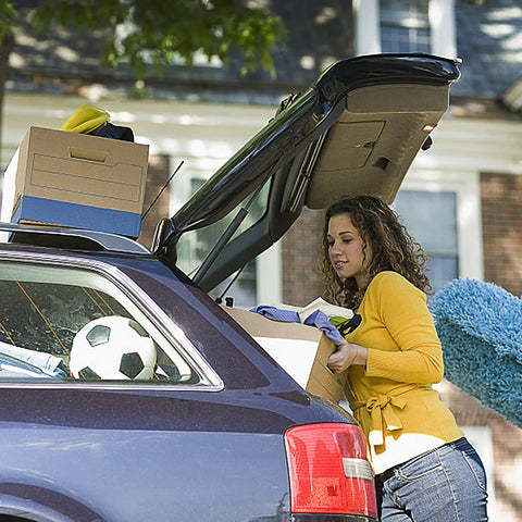 Woman packing car with Rear Hatch Lift Supports For Suburban Tahoe Yukon SUVs 07-14 Left And Right Gas Springs visible
