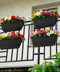 Level Up Your Porch Decor With This Ace Two Tier Railing Planter Box Set Black Window Boxes For Balcony Deck Garden Adjustable No Drill Clamp Rock Solid Iron Frame Easy Install Vibe with colorful flowers on a balcony railing.