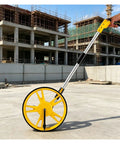 MZZKFC 3.3ft Foldable Mechanical Hand Push Distance Roller Wheel on construction site with yellow wheel and aluminum pole.