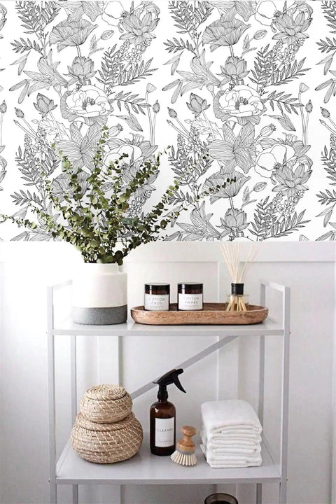 Black And White Lotus Lily Leaf Peel And Stick Wallpaper Self Adhesive Prepasted Mural For Walls Easy To Install 17.7 Inch Wide By 118 Inch Long Covers About 14.5 Sq Ft Thick Durable Material No Pattern Matching, shown on a wall behind a shelf.