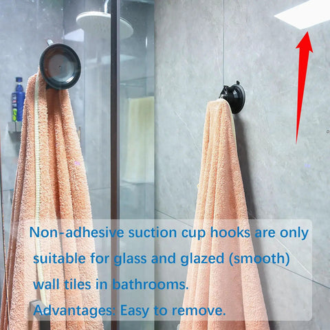 Heavy Duty Suction Cup Hook With Bombproof Grip For Window And Glass Walls featuring towel hanging on glass shower wall.