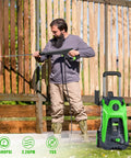 Man using Electric Pressure Washer 2200 PSI 2.0 GPM Beast Power Cleaner with 4 Interchangeable Nozzles on wooden fence