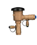 Front view of brass Zurn Wilkins 1-inch 720A pressure vacuum breaker assembly with black cap
