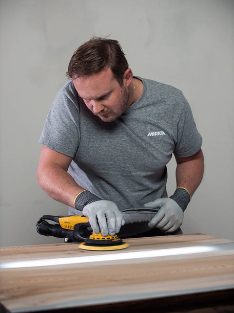 Man using Top Tier 6 Inch Random Orbital Sander Featuring A Smooth Brushless Motor And Effective Dust Extraction on wood.