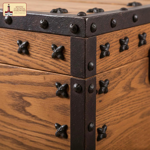 Colonial Era Solid Cast Iron Decorative Nailhead Studs on wooden chest corner, vintage clavos hardware Victorian style