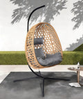Hanging Egg Chair With Stand For Patio And Garden Wicker Swing Hammock Style With 350 Lbs Capacity in Yellow Gray on patio