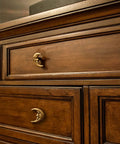 Set Of Six Gold Finish Cast Iron Crescent Moon Face Drawer Pulls For Celestial Decor installed on wooden dresser