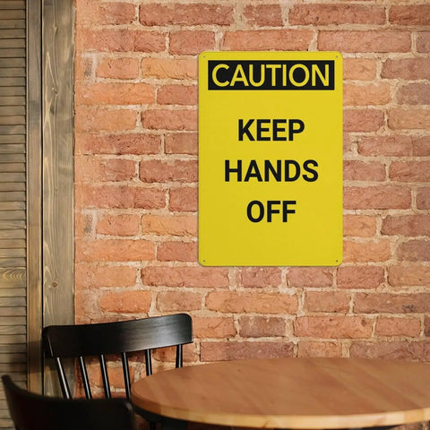 Keep Hands Clear Caution Sign 8x12 Aluminum UV Safety Plaque mounted on brick wall indoors
