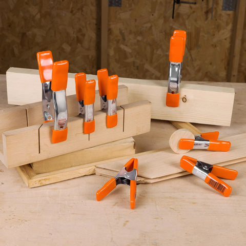 Heavy Duty Spring Clamp Set 4-Inch And 6-Inch Clamps With 1-Inch And 2-Inch Jaw Openings, 10-Piece Nickel-Plated Steel Clamps in use on wood