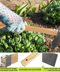 Gardener using Heavy Duty Curved Garden Hoe Mattock with Wooden Handle Fifteen Point Four Inch Stainless Steel Digging Weeding Tool in garden.
