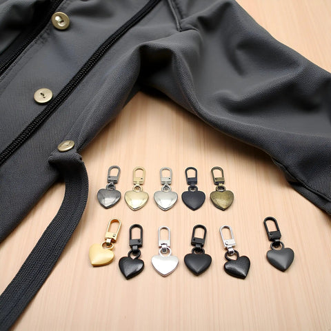 Five Piece Multicolor Heart Shaped Zipper Pull Replacement Kit shown with array of metal heart pulls and a jacket