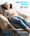 Woman relaxing on sofa using Full Body Massage Mat With Heat And Shiatsu Kneading For Deep Tissue Back Pain Relief
