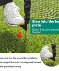Person stepping on base plate to install Temporary Fence With Posts For Pets And Kids Portable Yard Barrier Black Plastic Mesh.