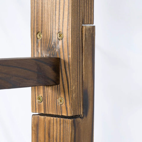 Close-up of carbonized wood joinery on garden arbor for outdoor weddings, showing sturdy construction and weather-resistant finish.