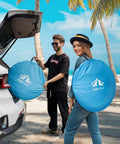 Couple carrying pop up beach tent for 2 to 4 people large sun shade shelter with instant setup no poles or tools ideal for beach