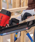 Person using nail gun with 30 Degree Paper Collated Ring Shank Framing Nails With Round Head Galvanized For Outdoor Use 3 Inch By.120 Inch
