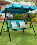 Three Seat Patio Swing With Steel Frame And Adjustable Canopy, All Weather Resistant Rocking Bench in garden with turquoise finish