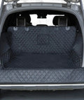 Heavy Duty Waterproof SUV Cargo Liner For Dogs With Bumper Flap Protector installed in full-size SUV trunk, black