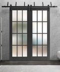 Built Tough Interior Barn Bypass Sliding Doors With Frosted Glass And Sturdy Solid Wood Panels In A Smooth Black Finish Sized At 72 By 96 Inches For Your Home Featuring Rock Solid Classic Design And Complete Heavy Duty Rolling Hardware Kit, shown in modern living space.