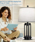 Set Of Two Farmhouse Style Table Lamps With USB Ports And AC Outlet 3 Way Dimmable Touch Beside a Woman Reading a Tablet